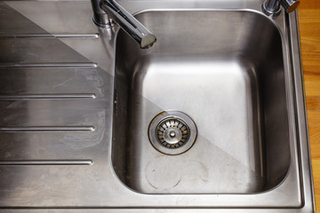 Dirty and cleaned to shine sink in the kitchen