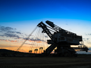 Horizontal vivid sunset industrial mining machine background bac