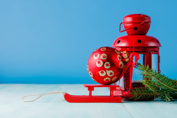 Red lantern and green pine on aquamarine background