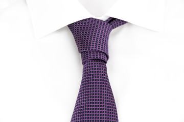 purple tie knotted the asymmetric Prince Albert Knot