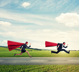 super heroes in red mask and cloak running