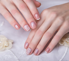 Obraz na płótnie Canvas Snow White manicure on female hands. Winter nail design.