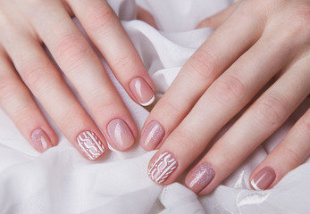 Snow White manicure on female hands. Winter nail design.