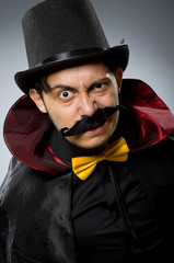 Funny magician man wearing tophat