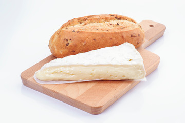 serving of creamy brie cheese and seed bread on table