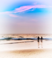 Fototapeta na wymiar Vertical pale glow ocean landscape two man walking background ba