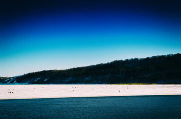 Fototapeta premium Horizontal vivid winter fishing on lake landscape background