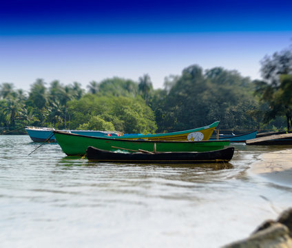 Horizontal vivid Indian boats on the beach bokeh background