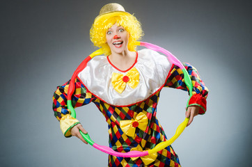 Clown in funny concept on dark background