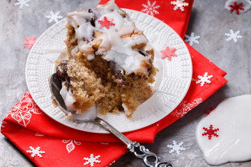 Plum cake in white icing for Christmas and New year