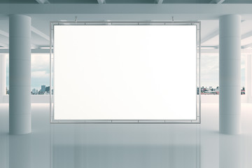 Blank white banner in modern empty open space office with big wi