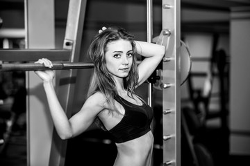 Fototapeta na wymiar Young pretty girl work out in the gym