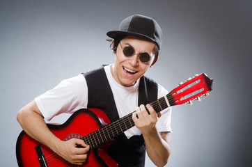 Funny guitar player in musical concept