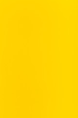 yellow colored vertical sheet of paper