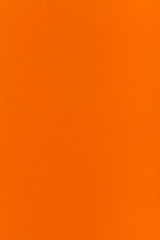 orange colored vertical sheet of paper