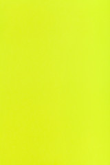 lemon yellow colored vertical sheet of paper