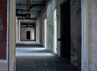 Fototapeta na wymiar Abandoned corridors at Russian factory backdrop
