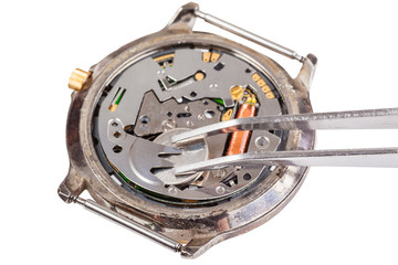 replacing battery in quartz watch isolated