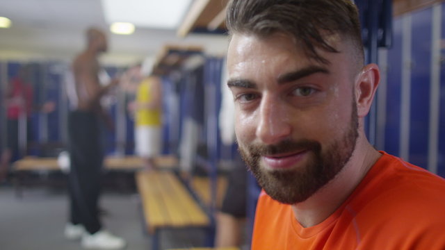  Portrait of man in gym locker room, sweating after a workout
