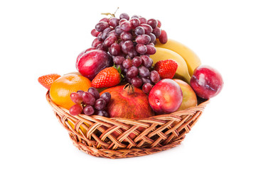 Fruits  in the basket. assorted fruits in wicker basket