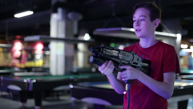Teenager shoots from the gaming machine simulator