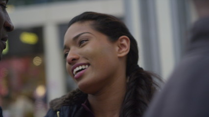  Attractive ethnic couple in love saying goodbye at train station or airport.