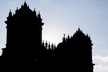 Obraz premium Silhouette of twin towers and dome of the historic Iglesia, Cusc