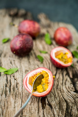 Passion fruit on a wooden board with knife