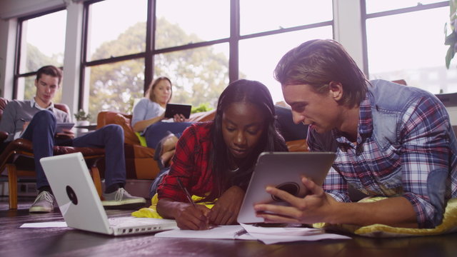  Cheerful young female student group working together with laptop computer