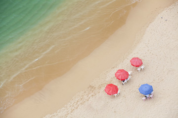 Fototapeta na wymiar Looking down at umbrellas and cabanas on a beach