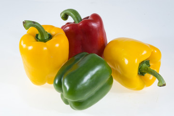 colorful bell peppers isolated on white background
