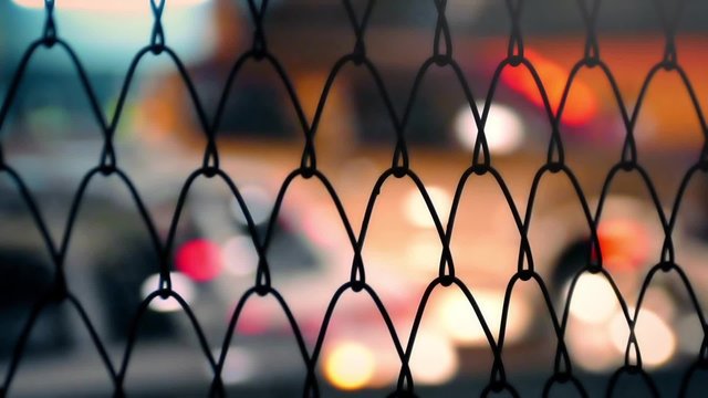 City Nightlife Through Fence Abstract