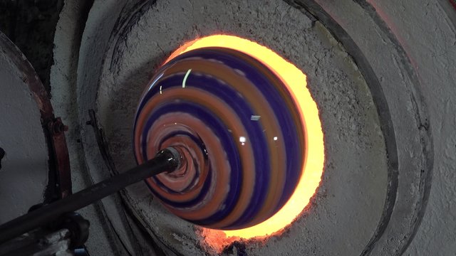 glassblower working in his workshop