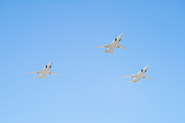 Tupolev Tu-22M3 (Backfire) supersonic swing-wing long-range strategic and maritime strike bombers fly against blue sky background