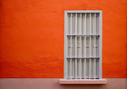 White Window Of An Orange House