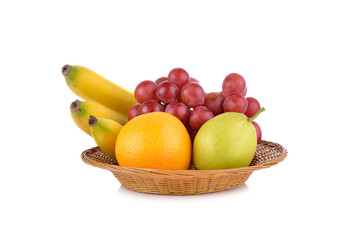 mixed fruit, banana, orange, pear, grape in basket on white back