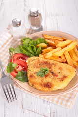 breaded meat and french fries