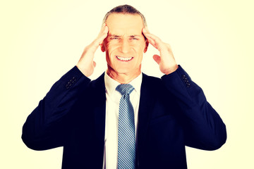 Businessman suffering from headache