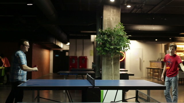 Father and son playing pingpong