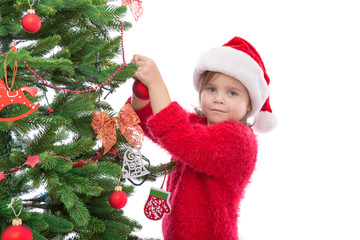 girl hanging Christmas decoration