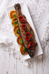 grilled rainbow trout with vegetables. vertical top view
