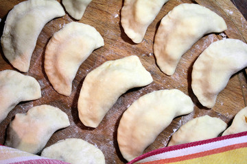 Prepared for cooking dumplings on a floured board.