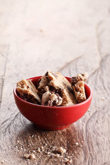 cookies in red cup on wooden table