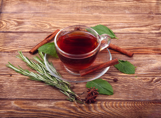 tea and tea leaves on wooden table