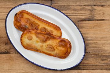 cookies in white dish on brown background