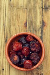 fried smoked sausages in ceramic bowl