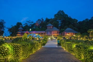 Naklejka premium RANONG PROVINCE, THAILAND-Dec 13:People take a photo at the fifth king's throne reproduce and mining statue on Dec 13, 2015 in Ranong Province, Thailand. Light decor for November and December.