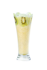 Fresh kiwi smoothie in tall glass isolated on white background