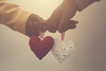 Couple in love holding hearts.