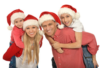 family with kids   in santa hats